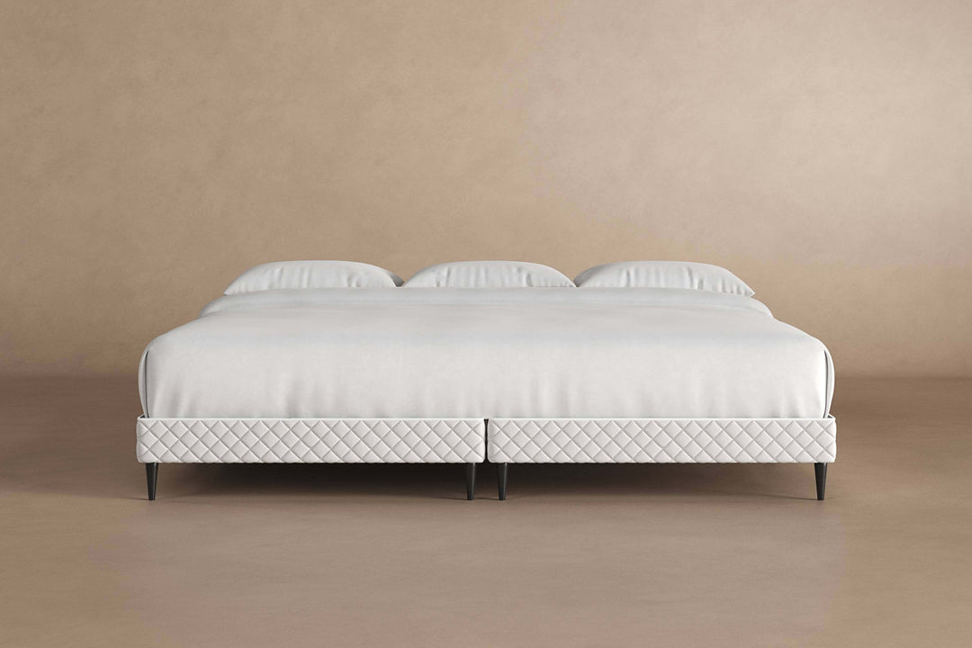 Front view of platform bed frame with a mattress