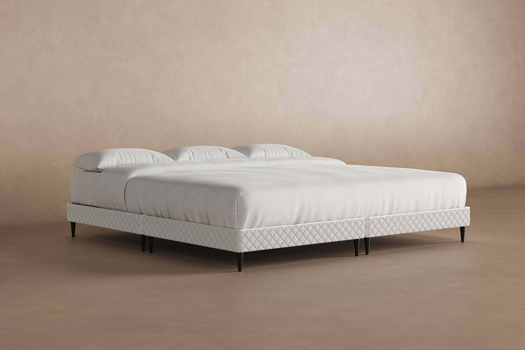 Angled view of platform bed frame with a mattress