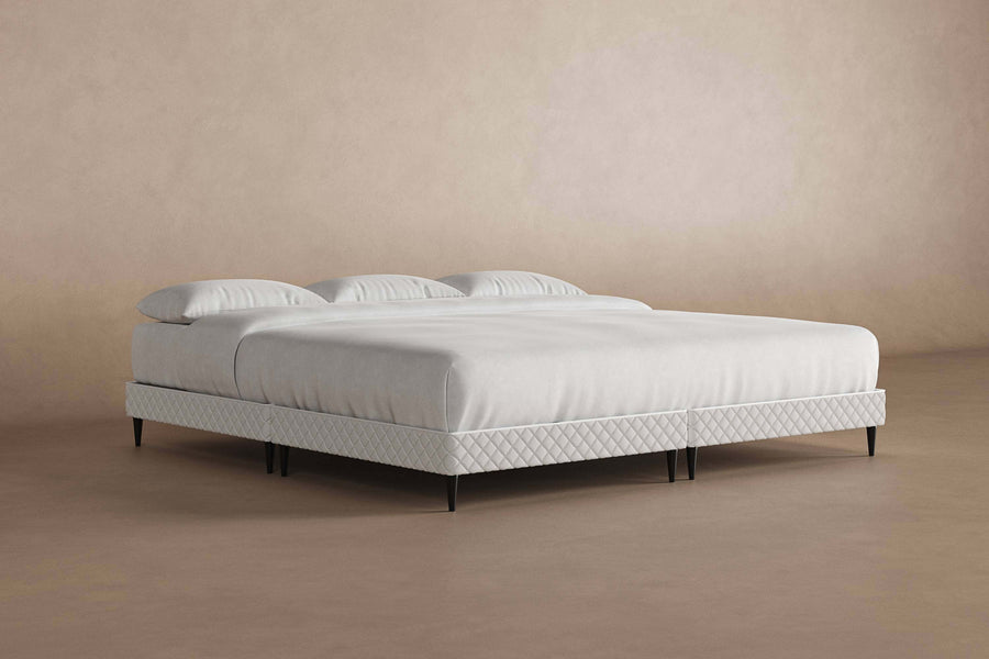 Angled view of platform bed frame with a mattress